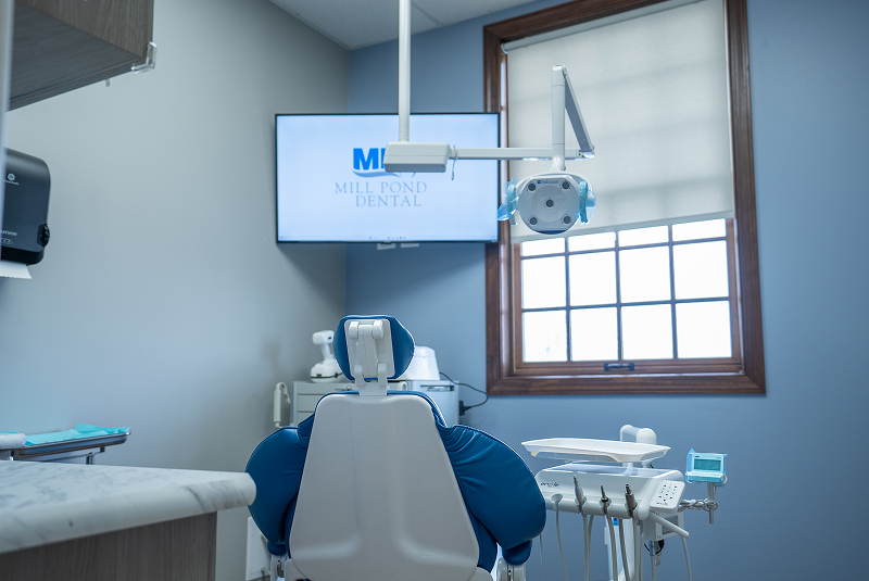 Dental treatment room with chair and advanced imaging equipment