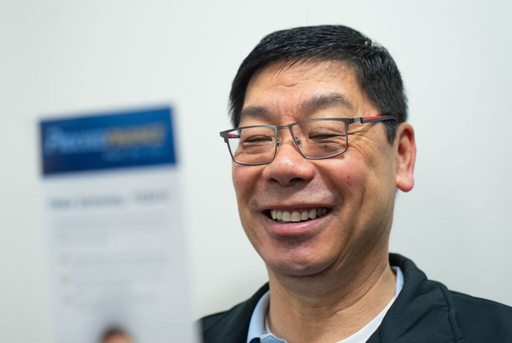 man looking at brochure